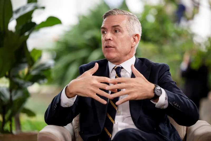 Mining industry expert sharing insights during a filmed interview for The Assay